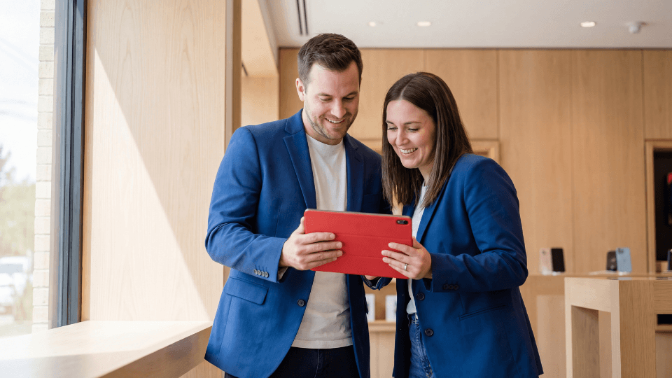 people watching ipad smiling standing